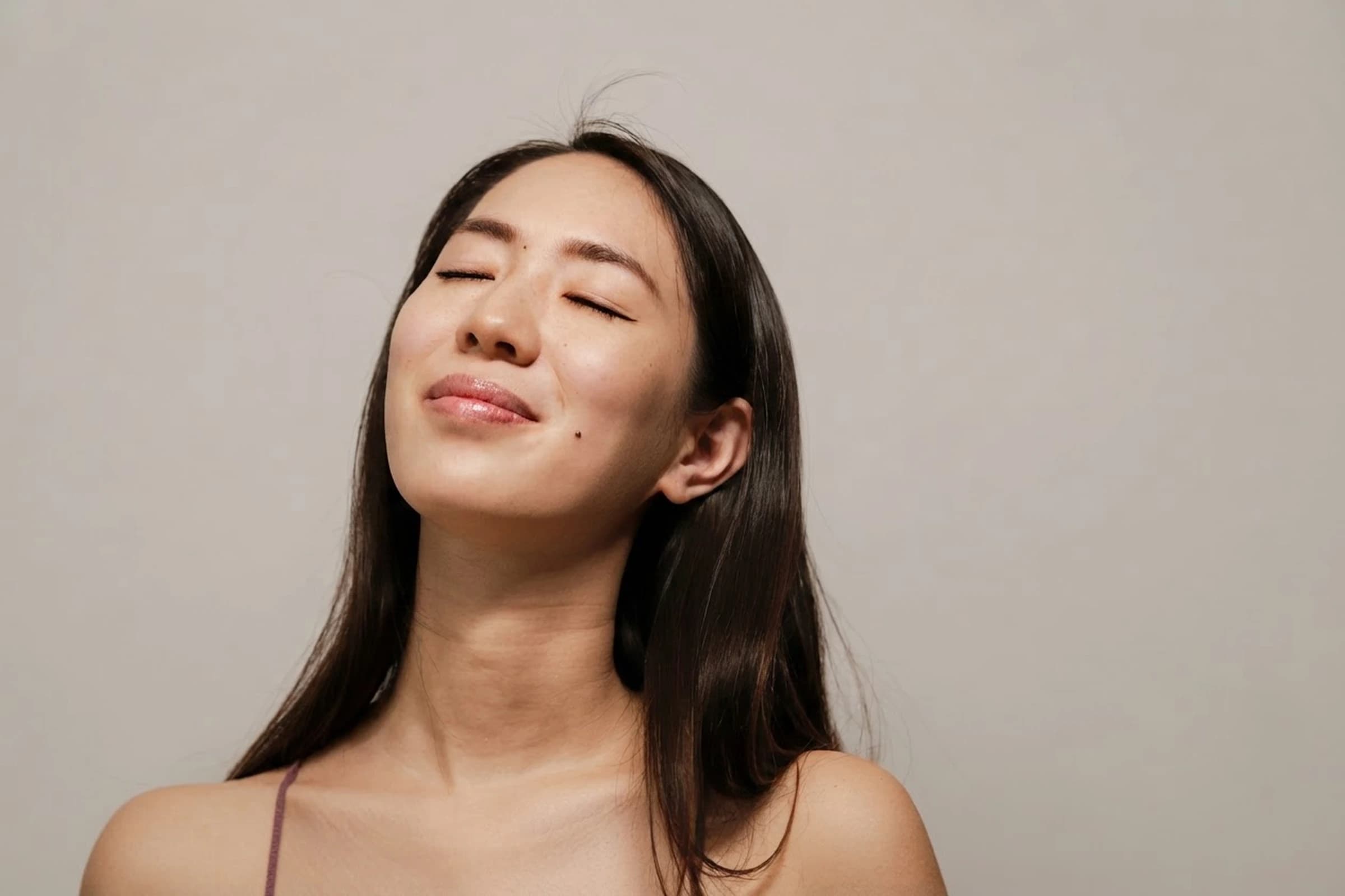 A model closing her eyes